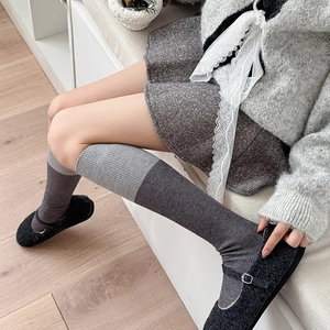 Detailed knit rib texture of grey color-blocked knee-high wool socks for women