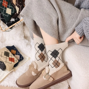 Detail showing vintage argyle wool crew socks with warm knit texture for winter