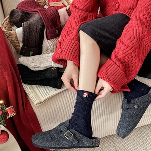Thick Christmas wool crew socks with festive embroidery and cozy ribbed knit texture
