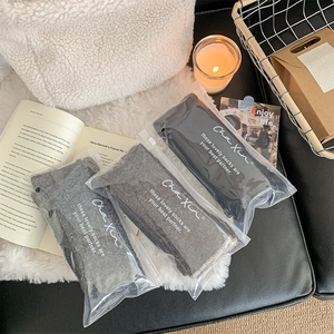 Three pairs of thick winter socks in black, grey and brown in premium zip packaging