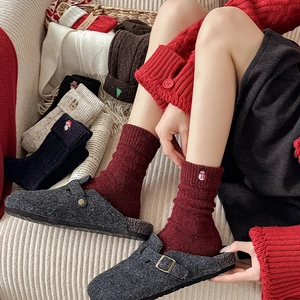 Close-up of festive Christmas wool blend socks with exquisite holiday embroidery details