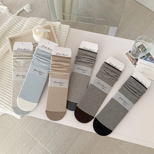 Detailed close-up of six-pair stripe mid-calf socks set in various aesthetic colors