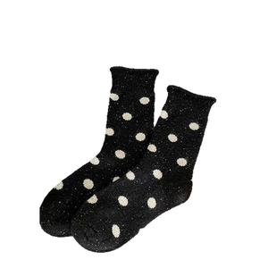 Vintage wool blend crew socks with large white polka dots on black thermal knit fabric