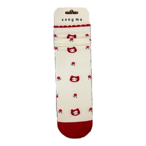 Cute off-white knit socks with red cat and flower patterns and ruffled edges
