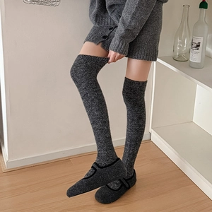 Dark grey knitted over-the-knee socks with cable texture and matching Mary Jane house shoes
