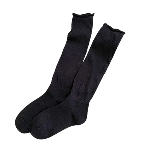 Black high-calf knit socks featuring a stylish wavy lettuce edge design for women