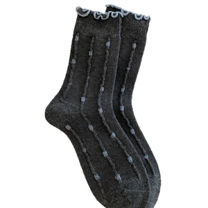 Dark grey wool crew socks with light blue polka dots and ruffle trim for women