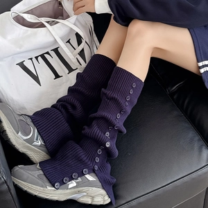 Navy blue ribbed knit leg warmers with decorative side buttons for a vintage JK style