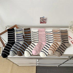8-pack striped mid-calf socks in assorted colors including pink, grey, and neutral tones
