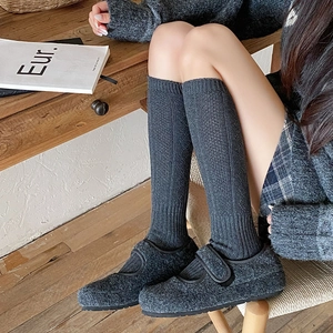 Grey vertical stripe knit knee-high socks with matching felt Mary Jane flats in winter style