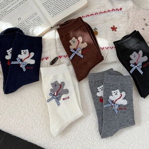 Detailed view of cute bear embroidery and 3D bowknot on premium knit mid-calf socks
