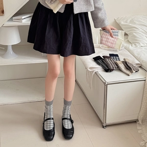 Classic plaid crew socks for women in Japanese school style with ribbed cuffs
