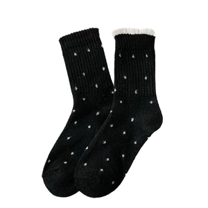 Japanese retro black wool mid-tube socks with white polka dots and delicate ruffle trim