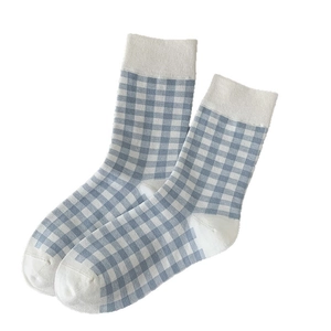Light blue and white checkered mid-calf socks with rib cuffs on a plain white background