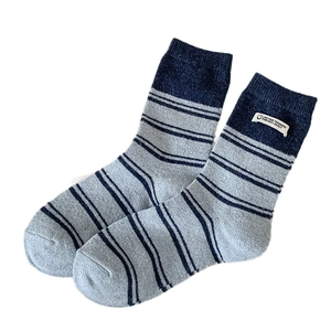 Korean style striped crew socks in blue and grey with a stylish woven label patch