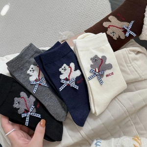 Close-up of cute cartoon bear embroidery and bow detail on five-color thick crew socks