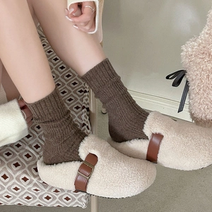 Fleece lined mule clogs in cream with brown leather buckle and wool ribbed crew socks
