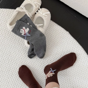 Detail of cute bear embroidery and blue plaid bow on thick thermal crew socks