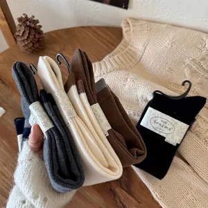 Multi-color thermal wool socks set in grey, cream, brown and black with paper wrap