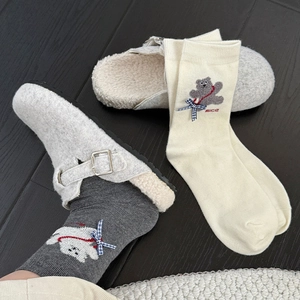 Detail of cute bear embroidery and blue plaid bow on mid-tube thick cotton socks