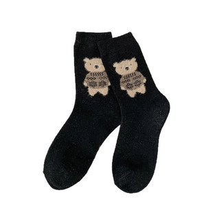 Thick black wool socks with cute flocked cartoon bear and ribbed cuffs for winter warmth