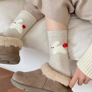 Cozy knit crew socks with white flocking rabbit and red pom-pom detail for women
