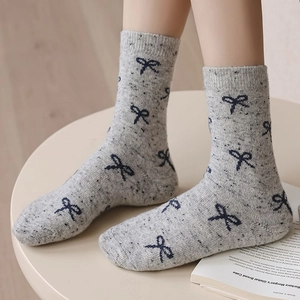 Thick grey wool socks with navy bow jacquard pattern for women in winter style