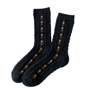 Thick wool blend black floral knit socks with colorful flower pattern and ribbed design