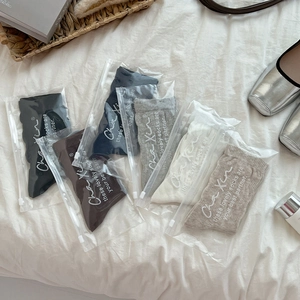 Detail of five-pair crew sock set in various colors with individual zipper bag packaging