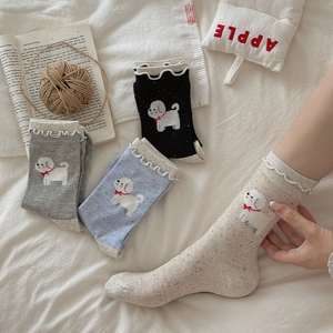 Detailed view of ruffle cuffs and cute puppy embroidery on cotton crew socks