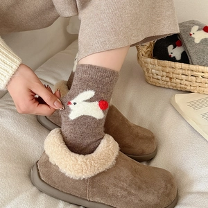 Winter thermal set with brown suede slippers and knit socks featuring cute rabbit pattern