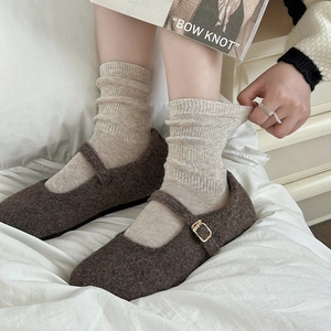 Brown felt Mary Jane flats with metal buckle and beige ribbed knit crew socks for women