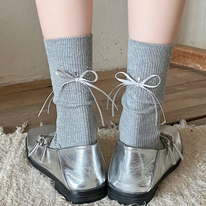 Gray knitted mid-calf socks with satin bow and rhinestones on the heel for women