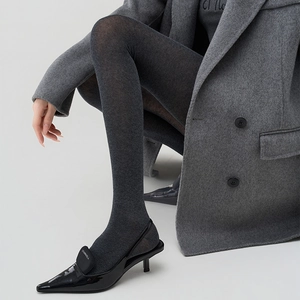 Minimalist charcoal grey high-density knit pantyhose paired with black pointed stiletto heels