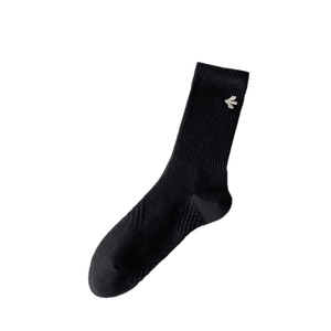 Black ribbed crew socks featuring a small white bird embroidery and reinforced heel