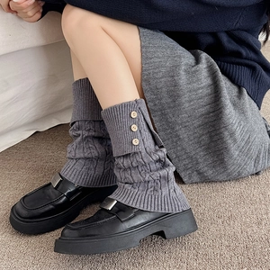 Retro grey cable-knit leg warmers for women with decorative wooden-style buttons
