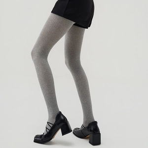 Korean style grey vertical striped tights paired with black shorts and retro block heels