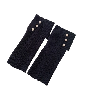 Retro black cable knit leg warmers for women featuring vintage wood buttons and fold-over cuff