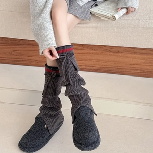 Dark grey knitted leg warmers with red stripes and bow ties for a stylish school style