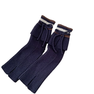 Striped navy knit leg warmers with ribbon bow and split hem in preppy college style