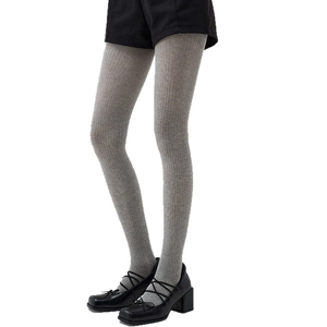 Grey vertical stripe knit tights paired with Mary Jane shoes for an elegant preppy style