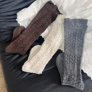 Three-pack vintage hollow knit calf socks in cream, brown, and grey blue for women