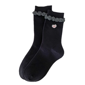 Japanese style black knit mid-calf socks with grey frill edges and heart button detail