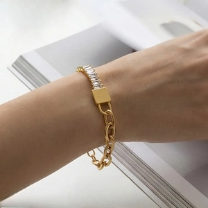 Macro detail of 18k gold plated stainless steel chain ring with sparkling zircon stones