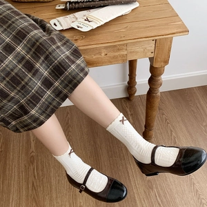 Japanese style white calf socks with hollow lattice texture and brown bow decoration
