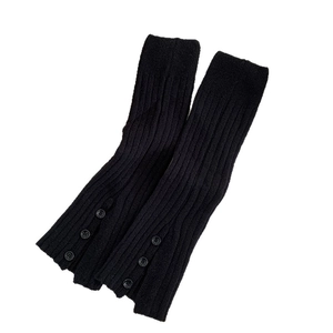 Black ribbed knit leg warmers with button slit detail for winter fashion styles