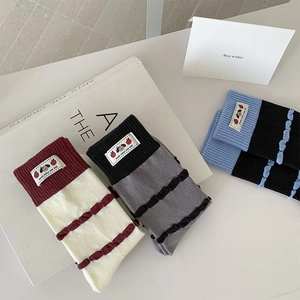 Three-pack cotton mid-calf socks with wavy stripes and cute cartoon fabric tags
