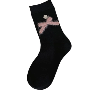 Japanese style black ribbed mid-calf socks featuring pink plush bow and floral shell button