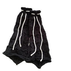 Gothic black knitted leg warmers with distressed cut-outs and white drawstring ties