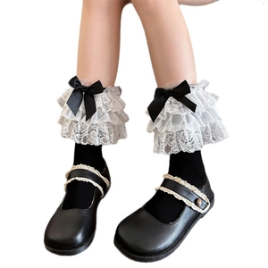 Japanese Lolita white lace trim mid-calf socks with black ribbon bows and Mary Janes